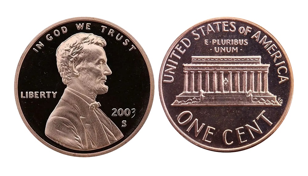 2003 Lincoln penny grading strip showing four condition tiers from worn to gem uncirculated
